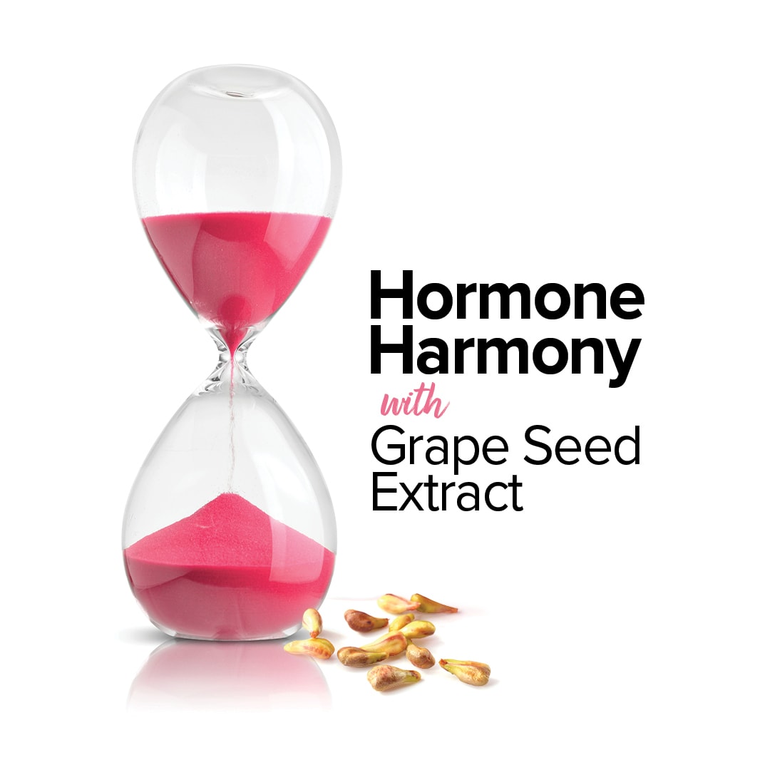 An hourglass filled with red sand and some grape seeds sprinkled down beside it. Text beside reads "Hormone Harmony with Grape Seed oil"