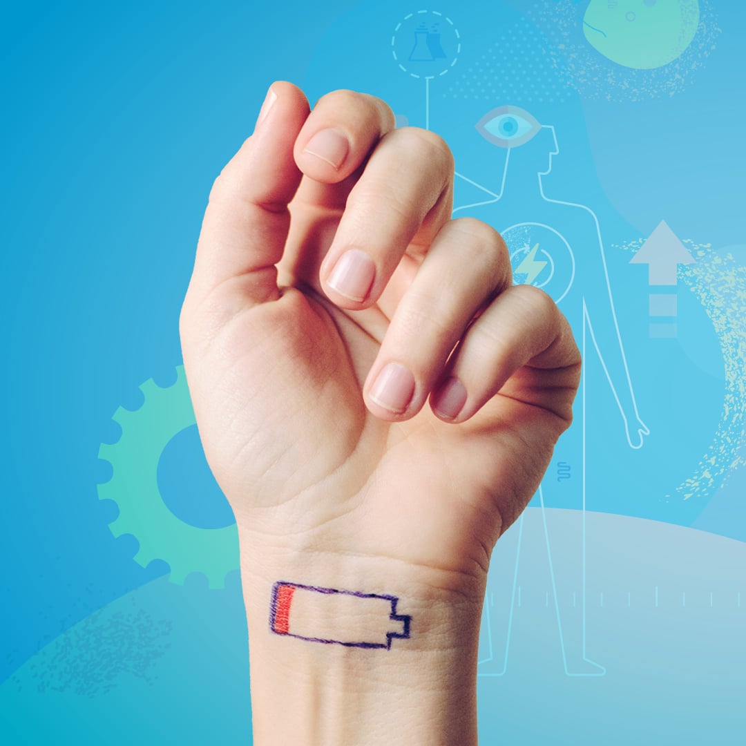 Someone holding up their hand. On the wrist is a drawing of a battery with just a little charge left in it