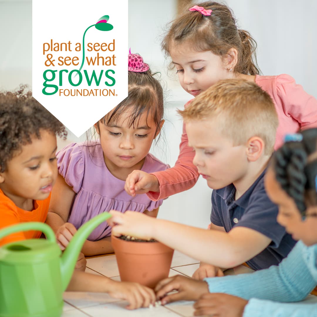 5 small children around a clay planting pot with a watering can in the foreground. there is a banner in the corner of the image that reads:" Plant a seed and see what Grows Foundation"